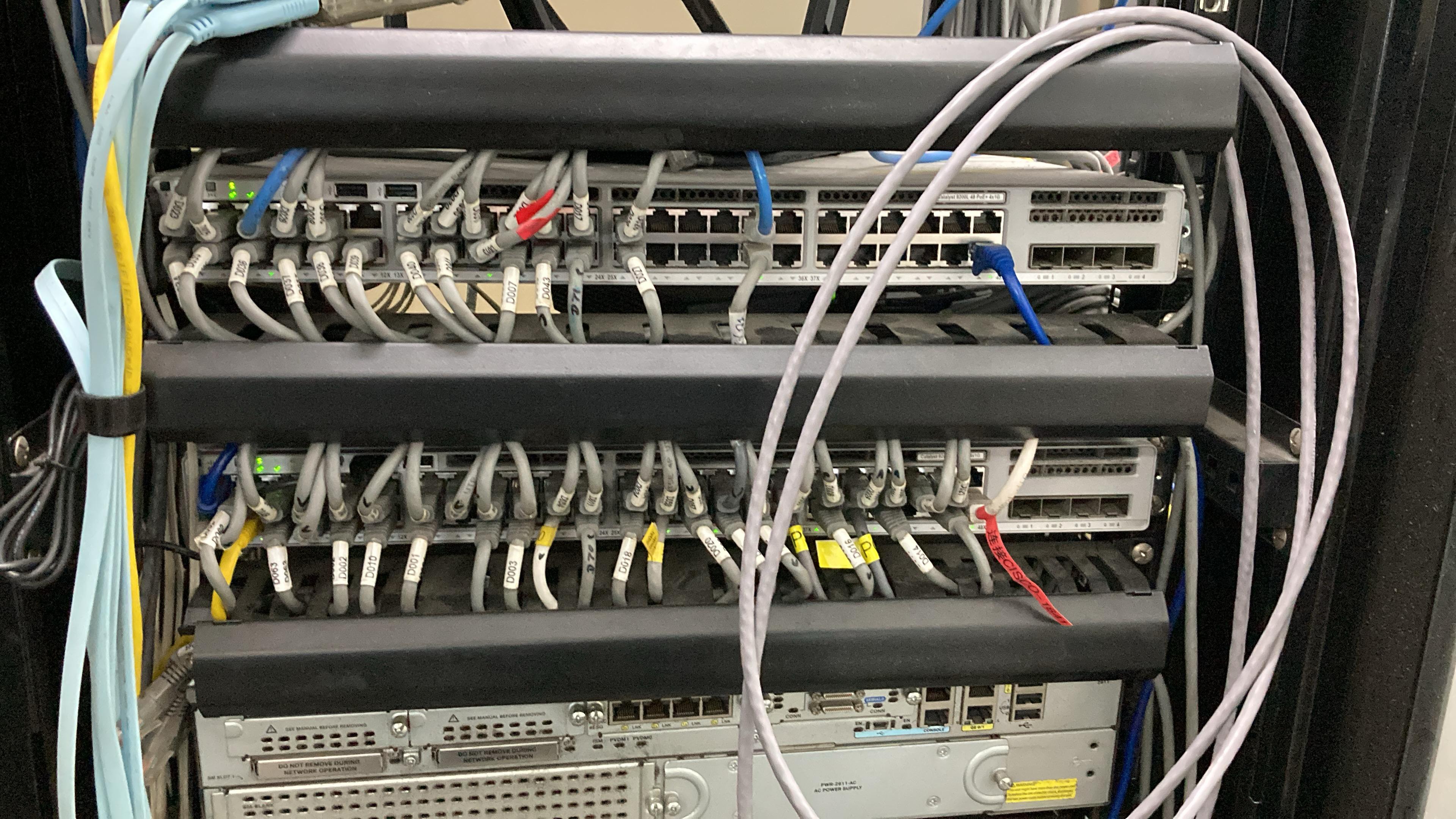 Representative field engineer working in a network rack environment