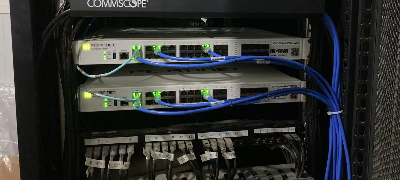 China field engineer working on network rack cabling
