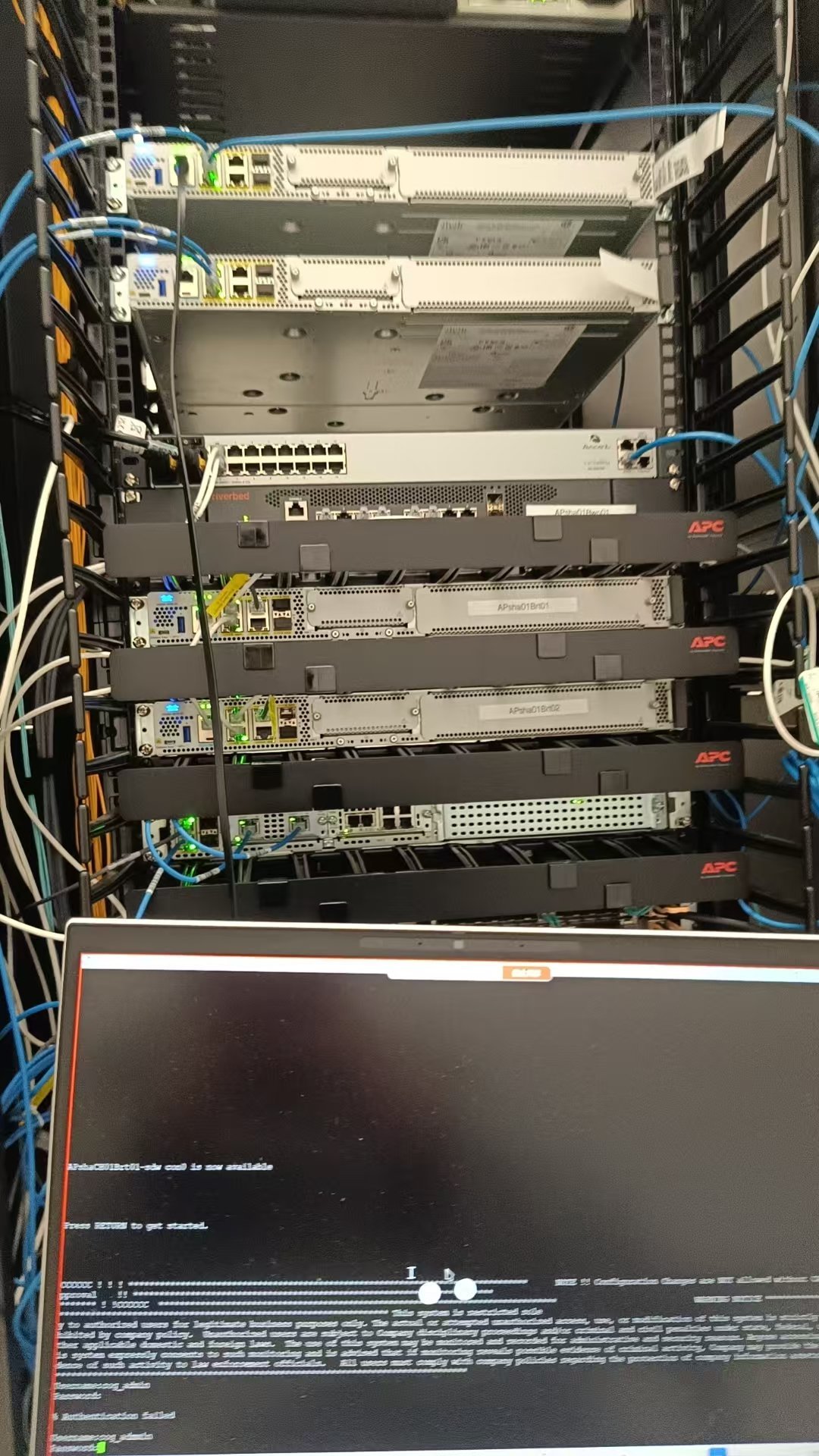Field engineer working on network rack cabling